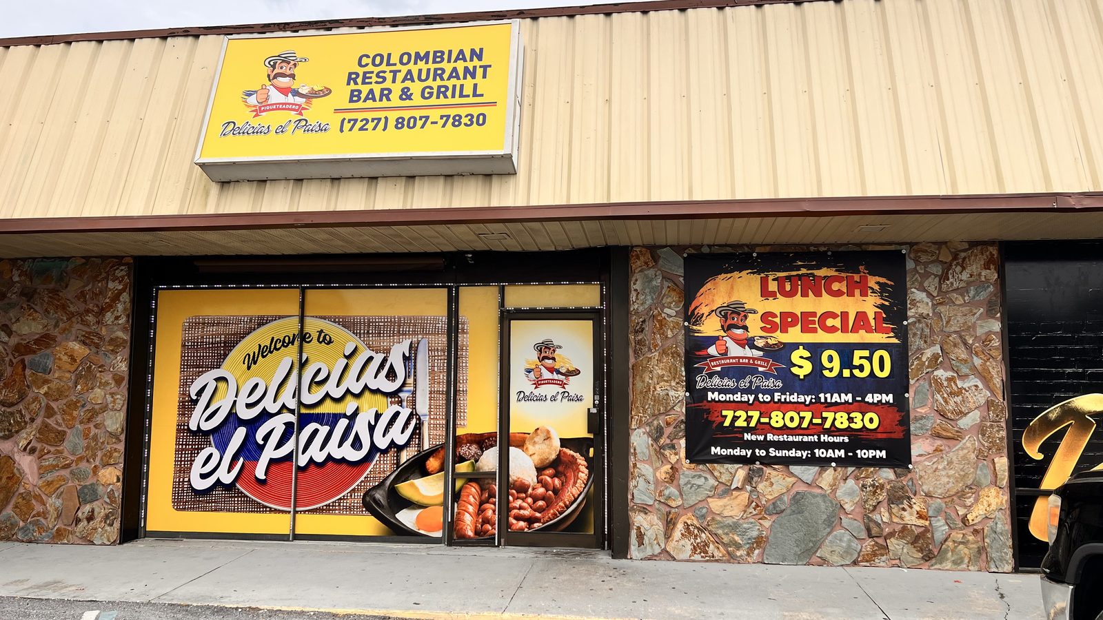 Restaurant storefront sign by isellwraps